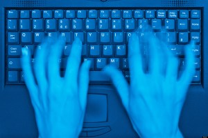 Typing on the keyboard of a Laptop Computer, Close Up.